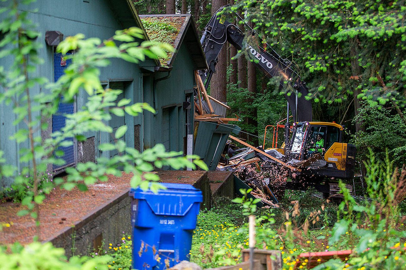 Mountlake Terrace maintenance crew Ty Burns begins demolishing “the bunkers” on Monday, June 10, 2024 in Mountlake Terrace, Washington. (Olivia Vanni / The Herald)