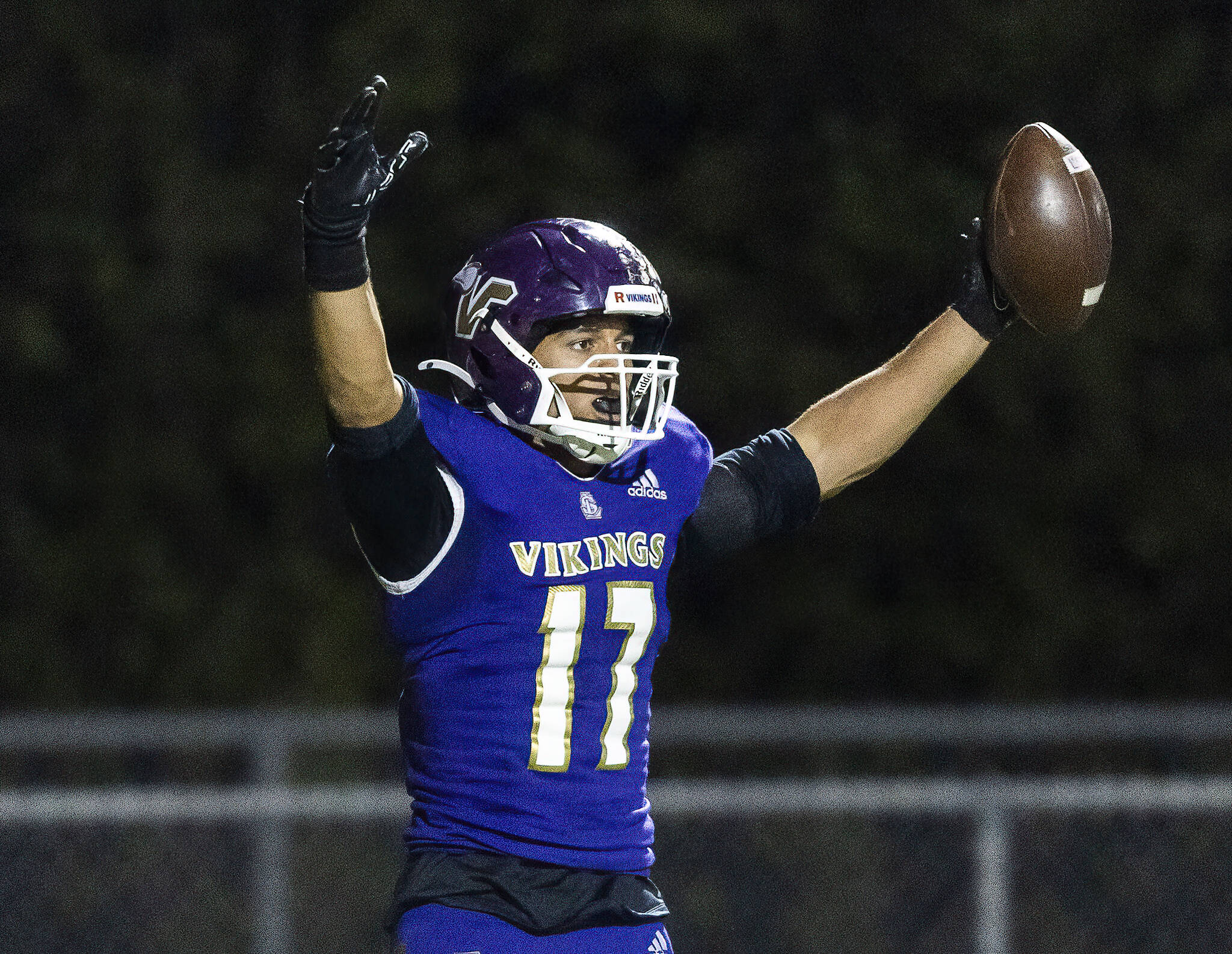 Lake Stevens’ Jayshon Limar puts his arms in the air in celebration after scoring a touchdown during the 4A district game against Tahoma on Friday, Nov. 8, 2024 in Lake Stevens, Washington. (Olivia Vanni / The Herald)