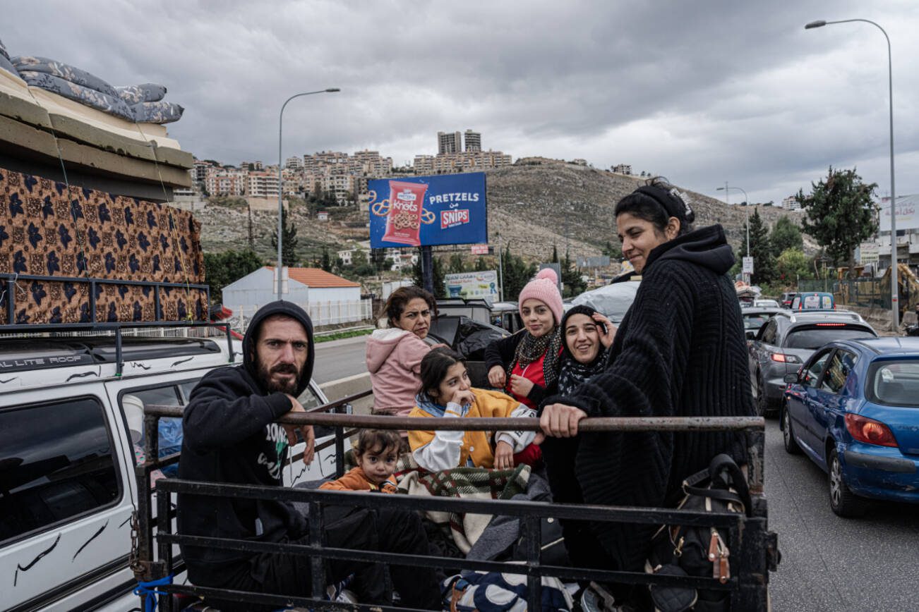 Residents from the south celebrate as they return to their homes, south of Beirut, Nov. 27, 2024. A cease-fire meant to end the deadliest war in decades between Israel and the Lebanese militant group Hezbollah officially took effect early Wednesday, less than a day after President Biden announced the deal and Israel approved its terms. (Daniel Berehulak /The New York Times)