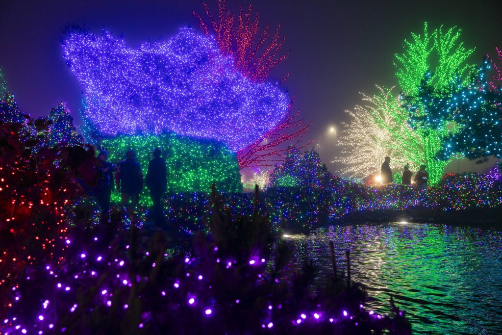 Lights are reflected off of the water of the fountain at the the entrance to the Tulalip Resort & Casino on Wednesday, Dec. 4, 2024 in Tulalip, Washington. (Olivia Vanni / The Herald)
